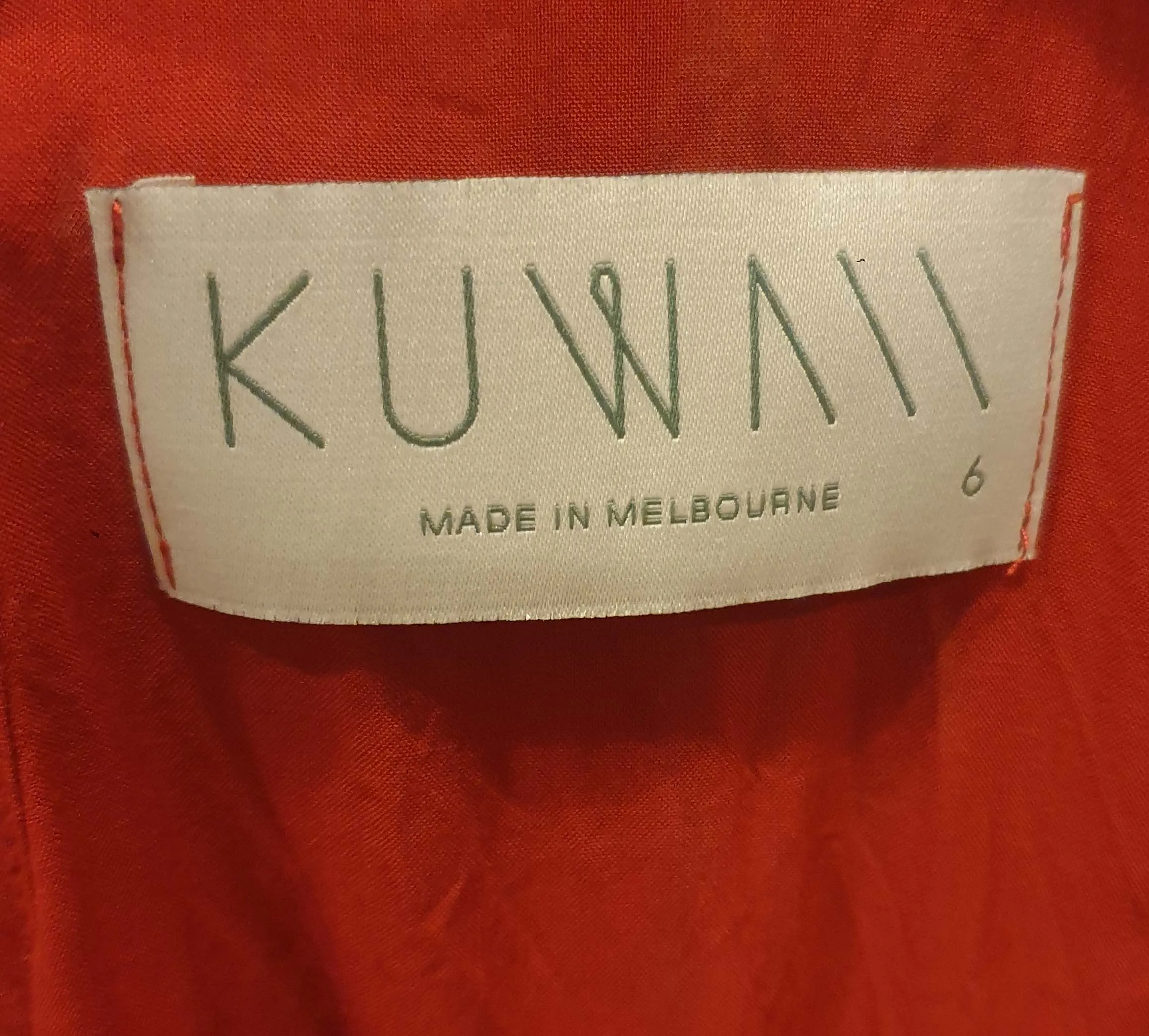 Kuwaii red singlet top size 6 (fits 6-8)